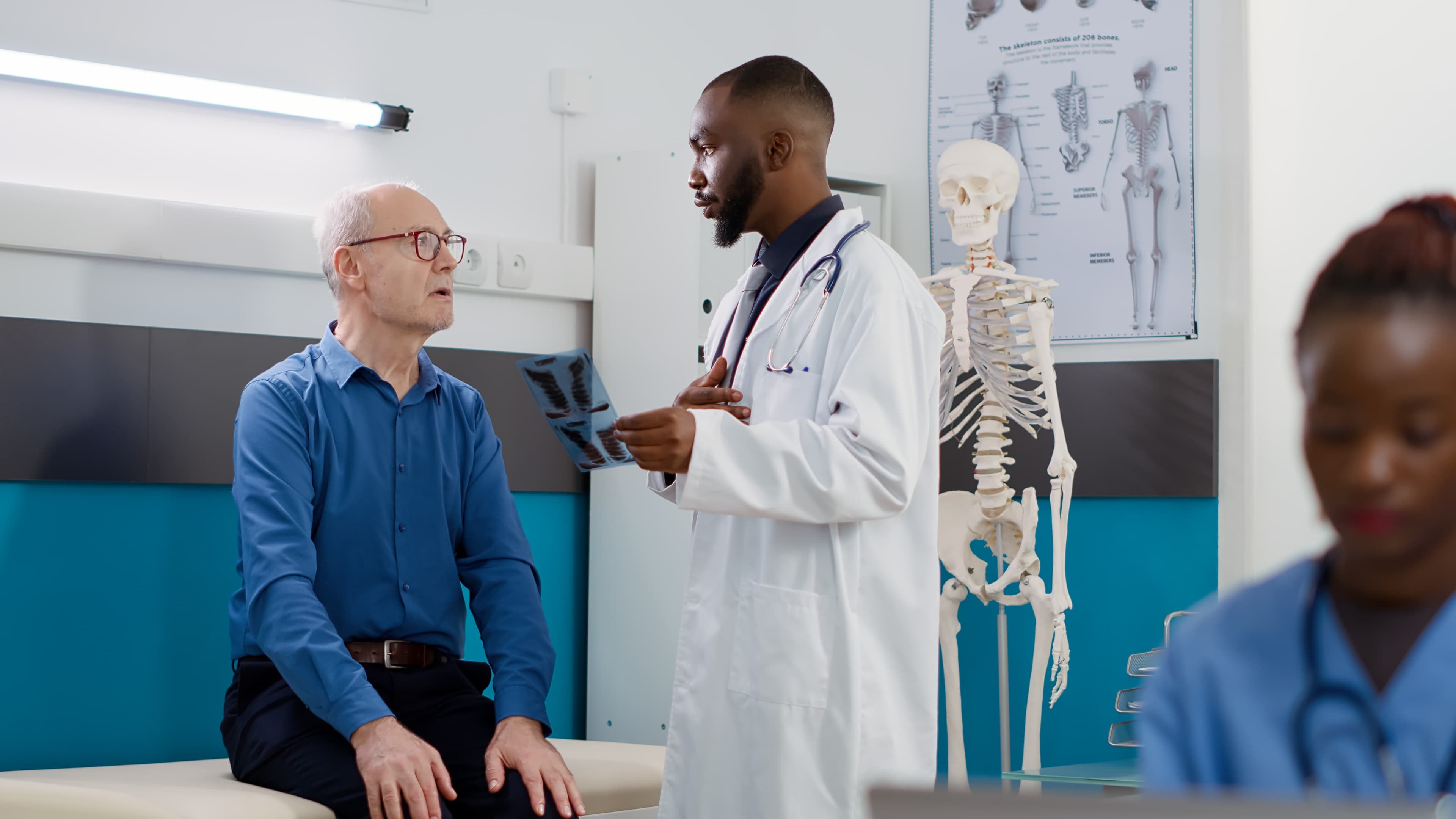 Board-certified orthopedic surgeon performing comprehensive patient evaluation at Mountain Spine & Orthopedics